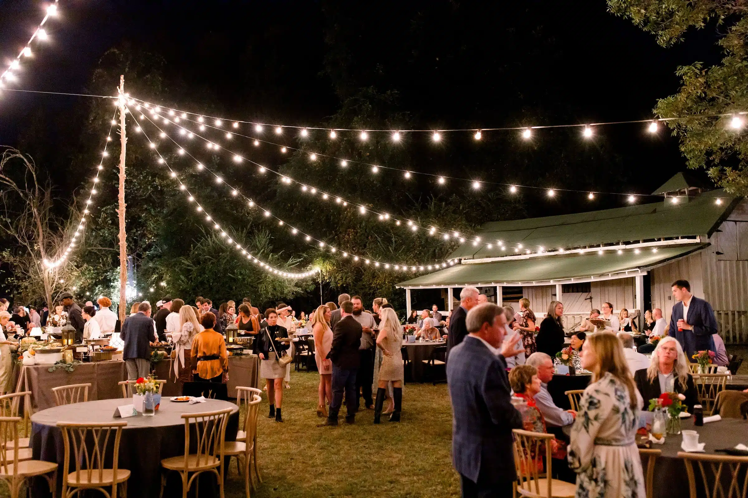 Outdoor evening party with string lights