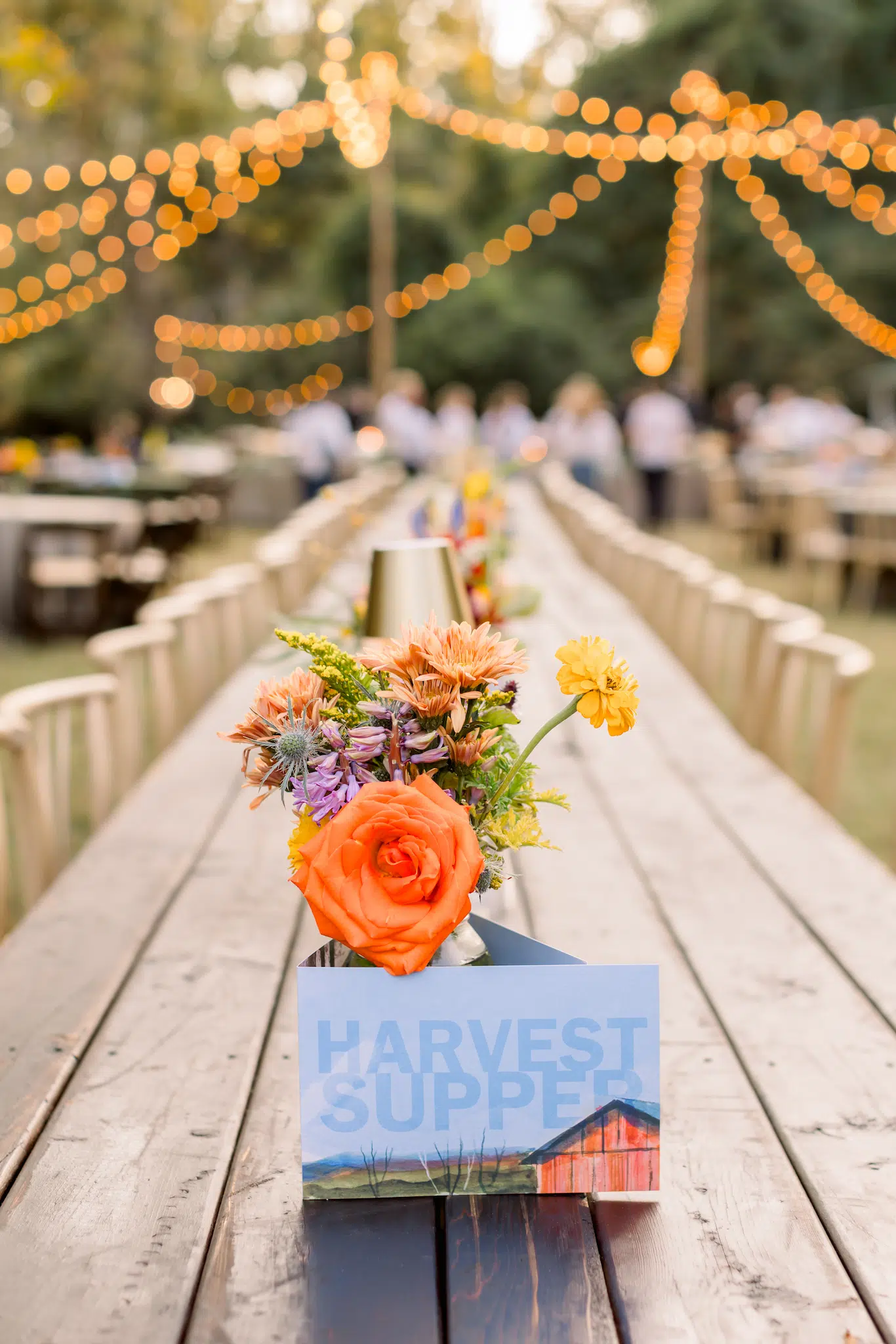 Outdoor dining with floral centerpieces.