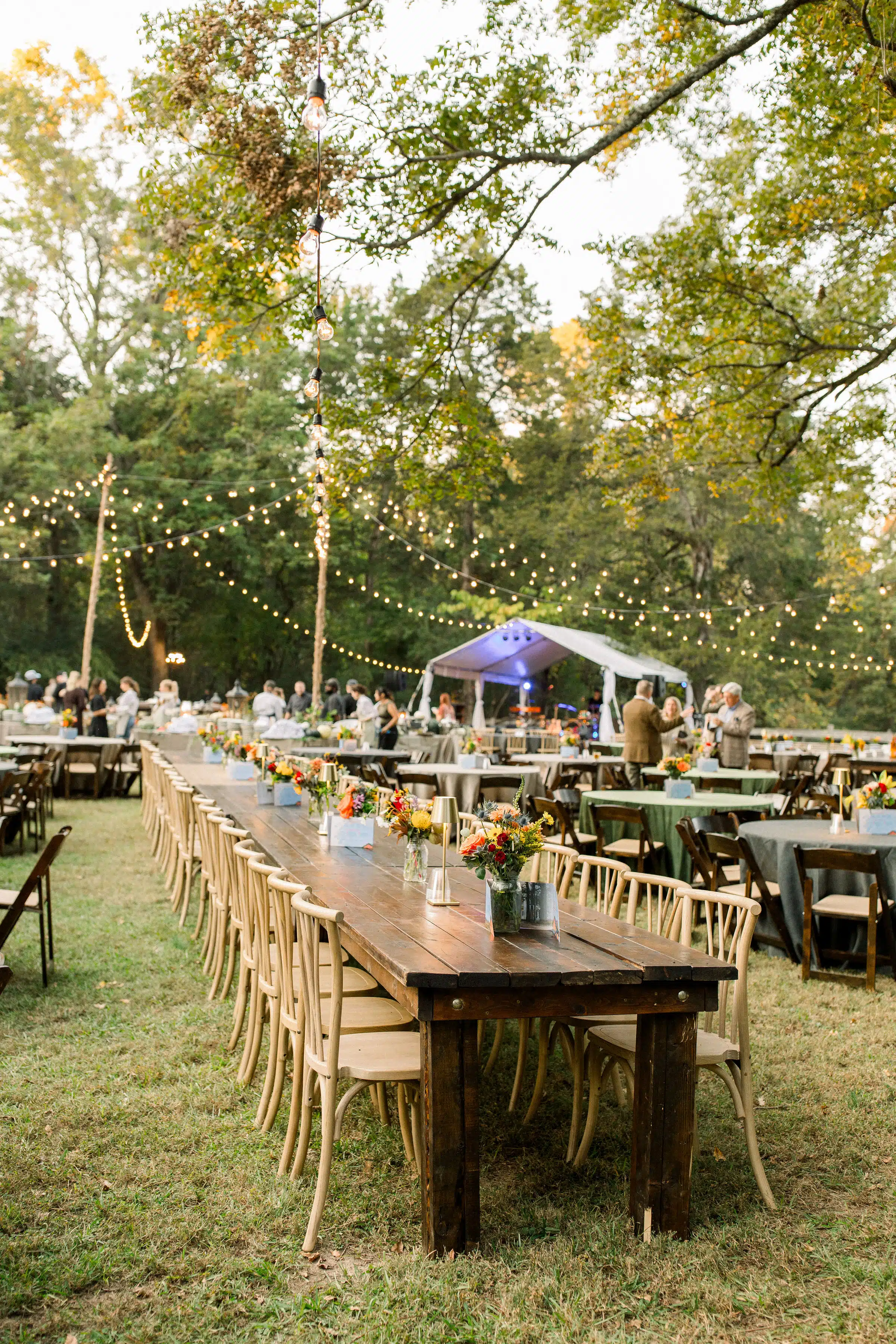 Outdoor event with decorated long tables