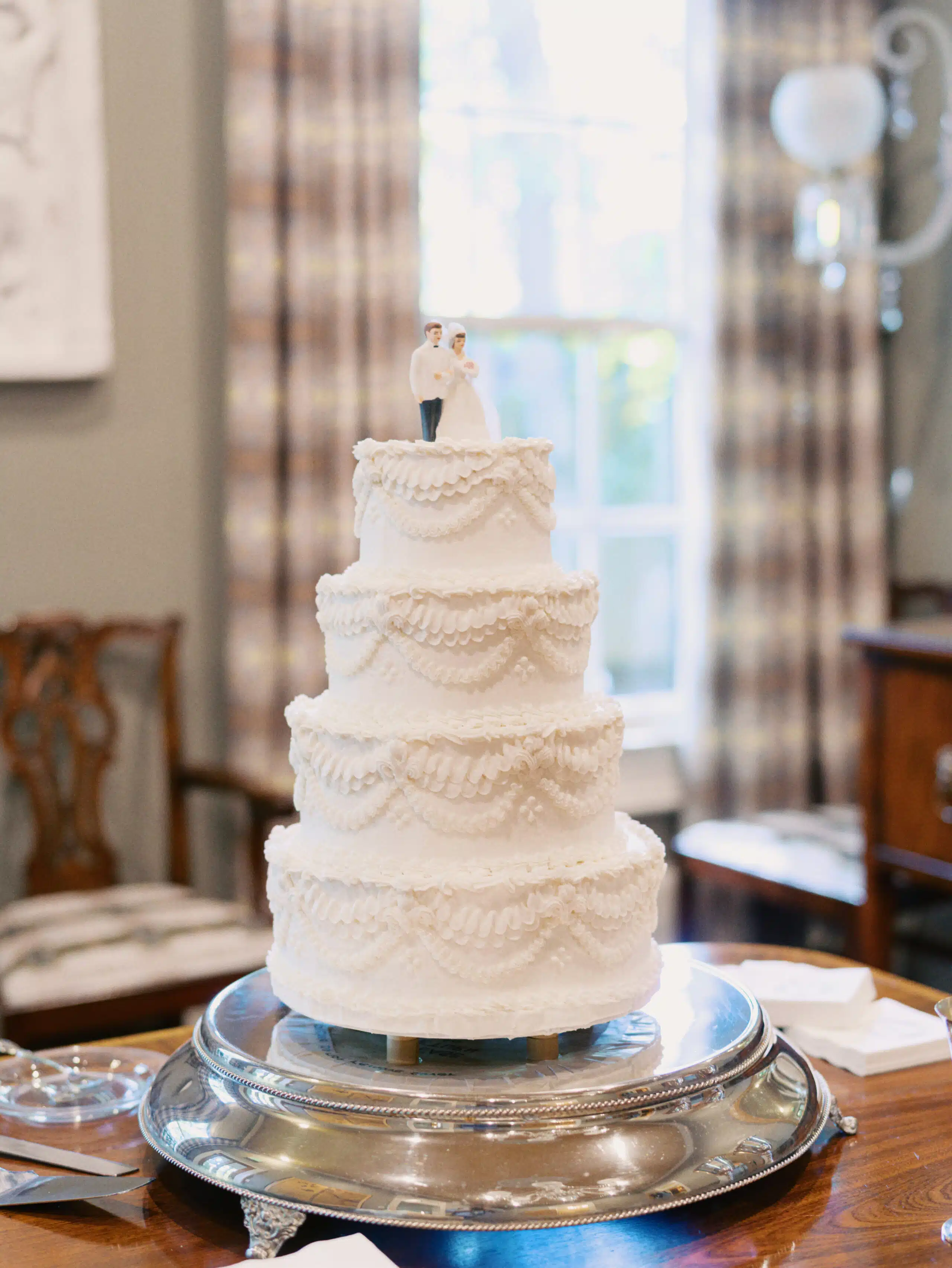 Elegant wedding cake with couple topper