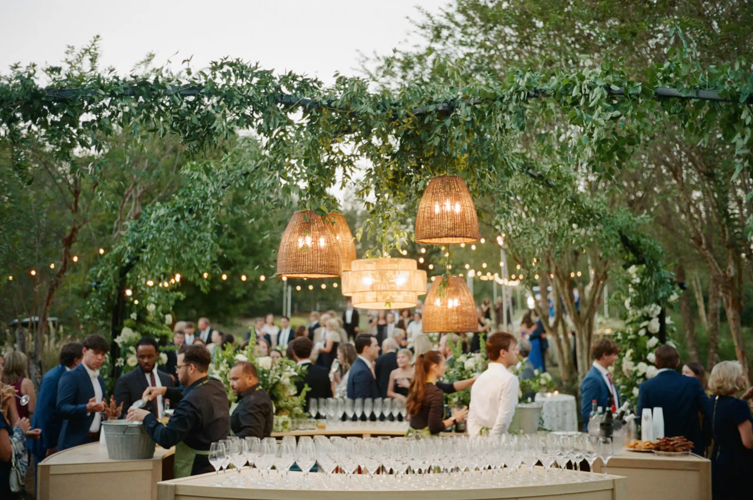Elegant outdoor event with guests mingling.
